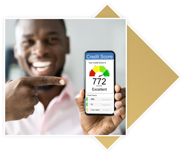 A man holding up his phone with the credit score 7 7 2.